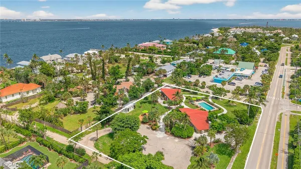 a view of a backyard with potted plants