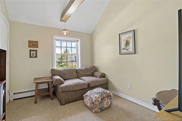 a living room with furniture and a window