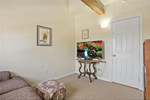 a view of a livingroom with furniture and toys
