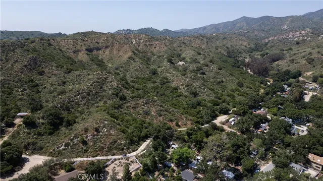 an aerial view of a house with mountain view