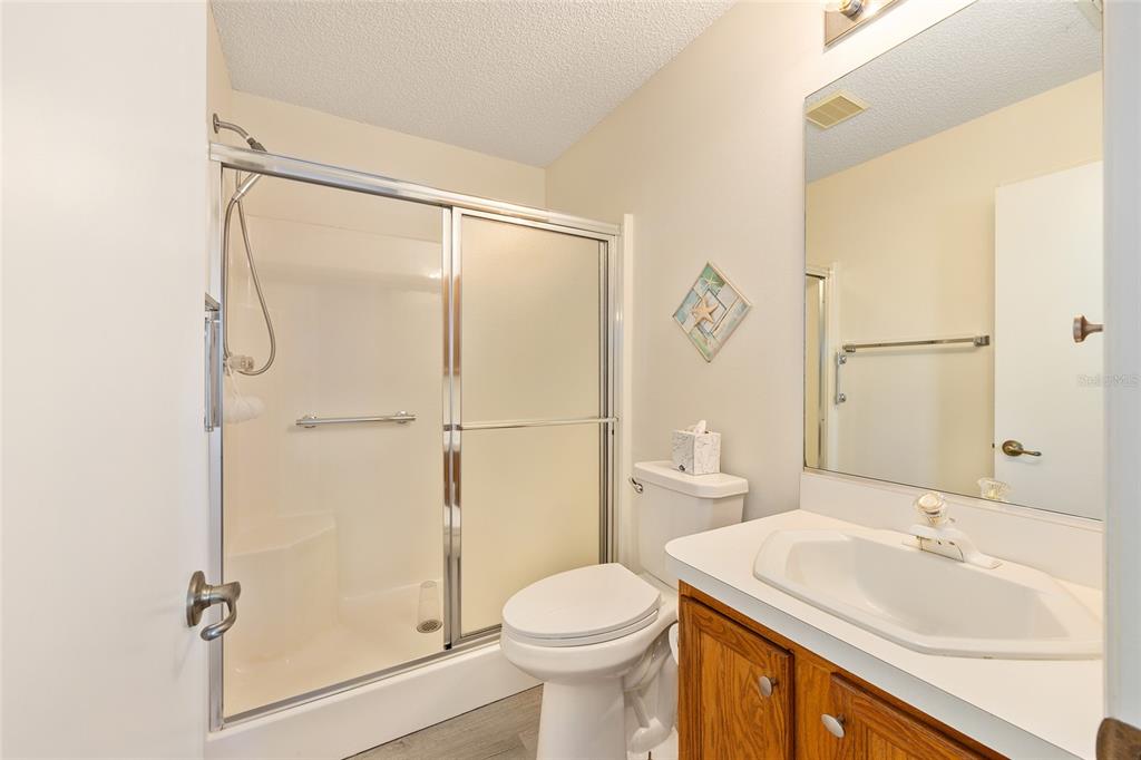 1710 Rosales Road The Villages, FL 32162 - Photo 12 of 23 a bathroom with a sink toilet and shower