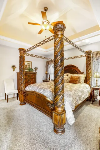 a bedroom with a bed and a night stand