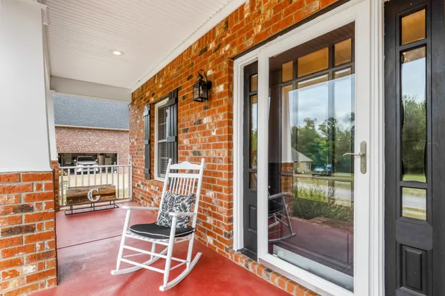 a view of a balcony with chairs
