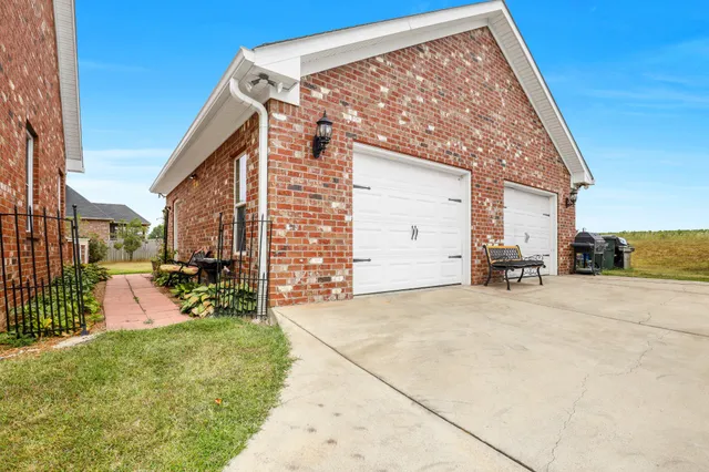 a bench is sitting in front of a brick building