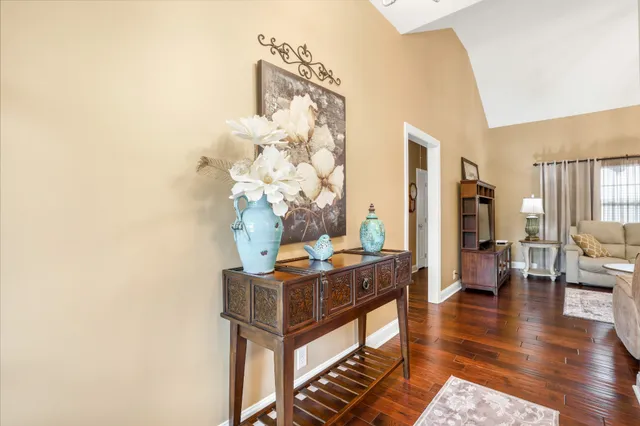 a view of a livingroom with furniture and wooden floor