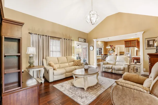a living room with furniture and a table