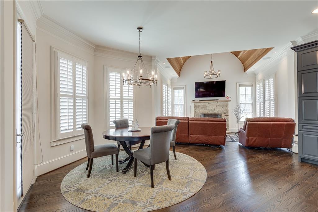 187 Fontaine Road Southwest Mableton, GA 30126 - Photo 29 of 84 a dining room with furniture a chandelier and wooden floor