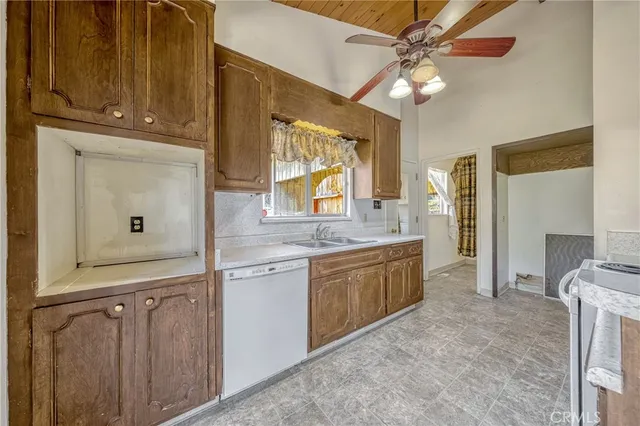 a large bathroom with a granite countertop double vanity sink a mirror and a shower