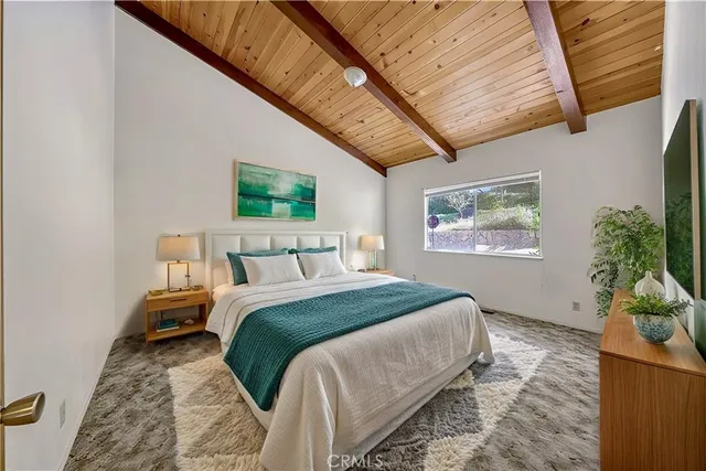 a bedroom with bed and a window