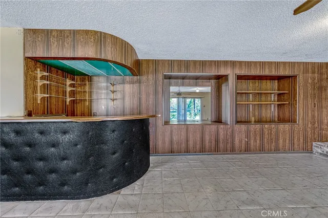 a kitchen with a sink and a kitchen area