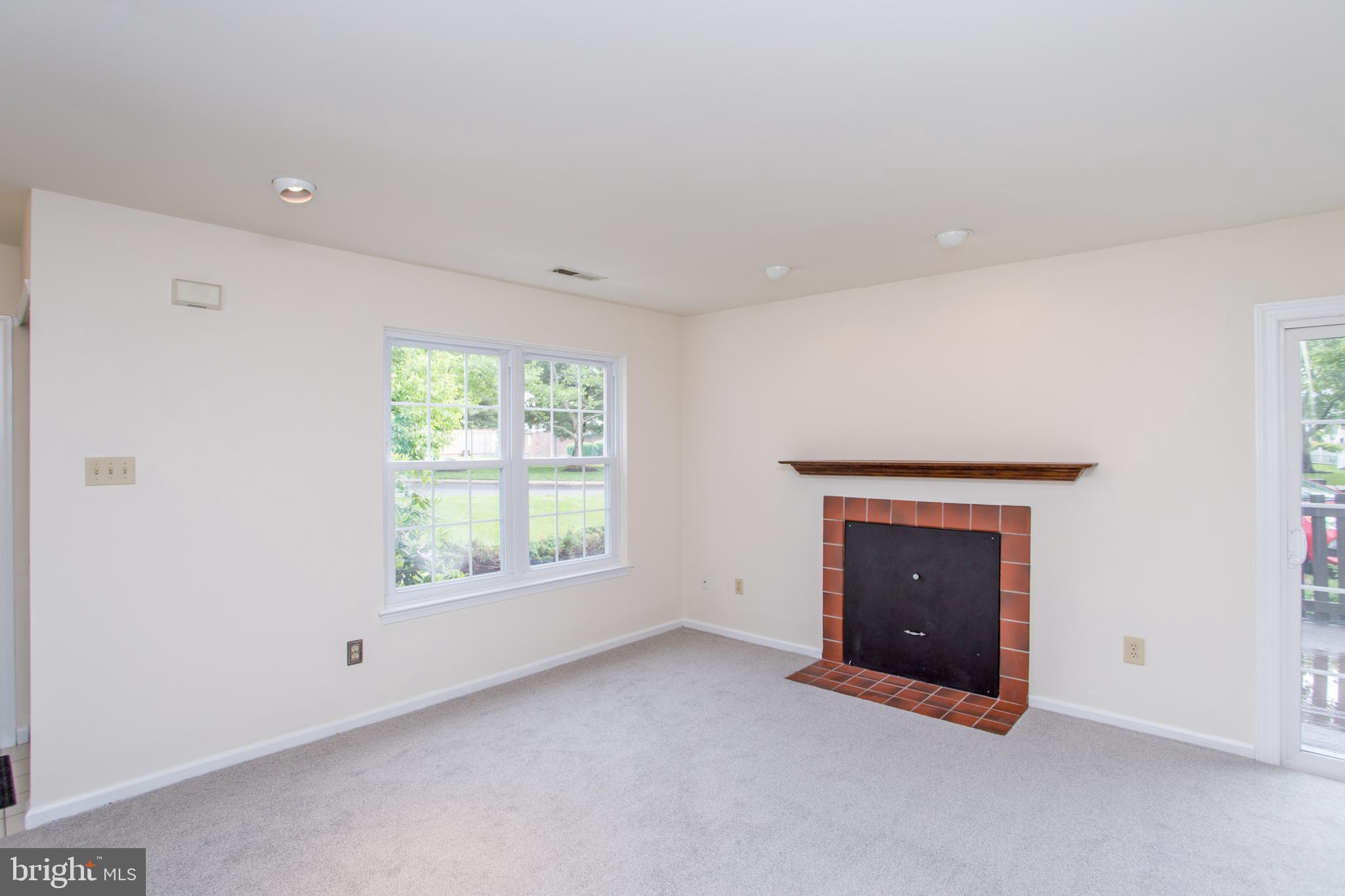 144 Carousel Circle Doylestown, PA 18901 - Photo 19 of 40 a view of an empty room with a window and a fireplace