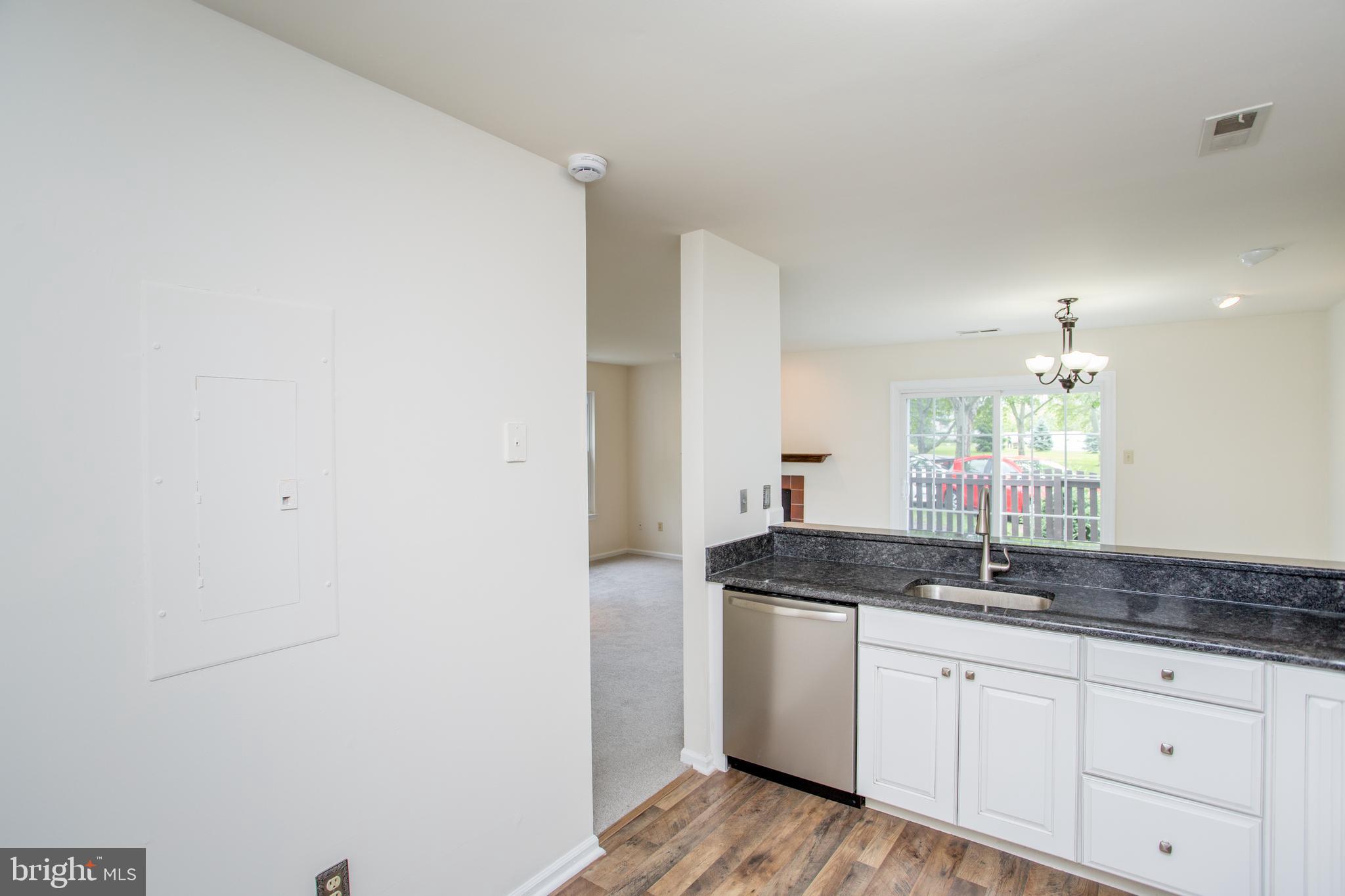 144 Carousel Circle Doylestown, PA 18901 - Photo 23 of 40 a kitchen with granite countertop white cabinets and a sink