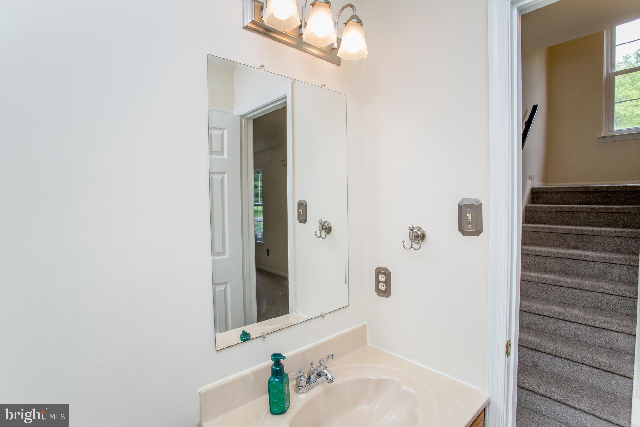 144 Carousel Circle Doylestown, PA 18901 - Photo 10 of 40 a bathroom with a sink and a mirror