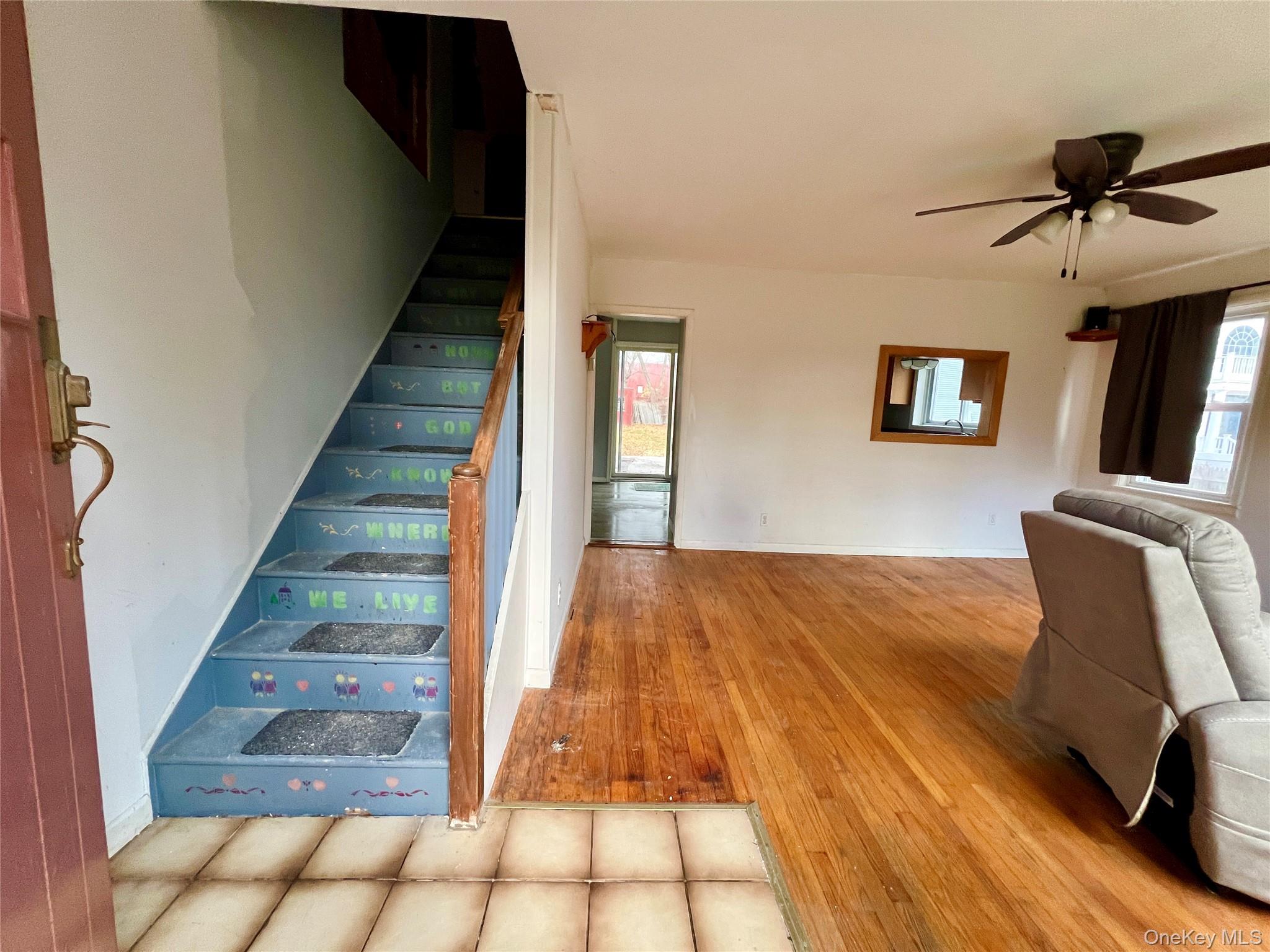 3 Davis Road Poughkeepsie, NY 12603 - Photo 19 of 34 Stairs with hardwood / wood-style floors and a ceiling fan