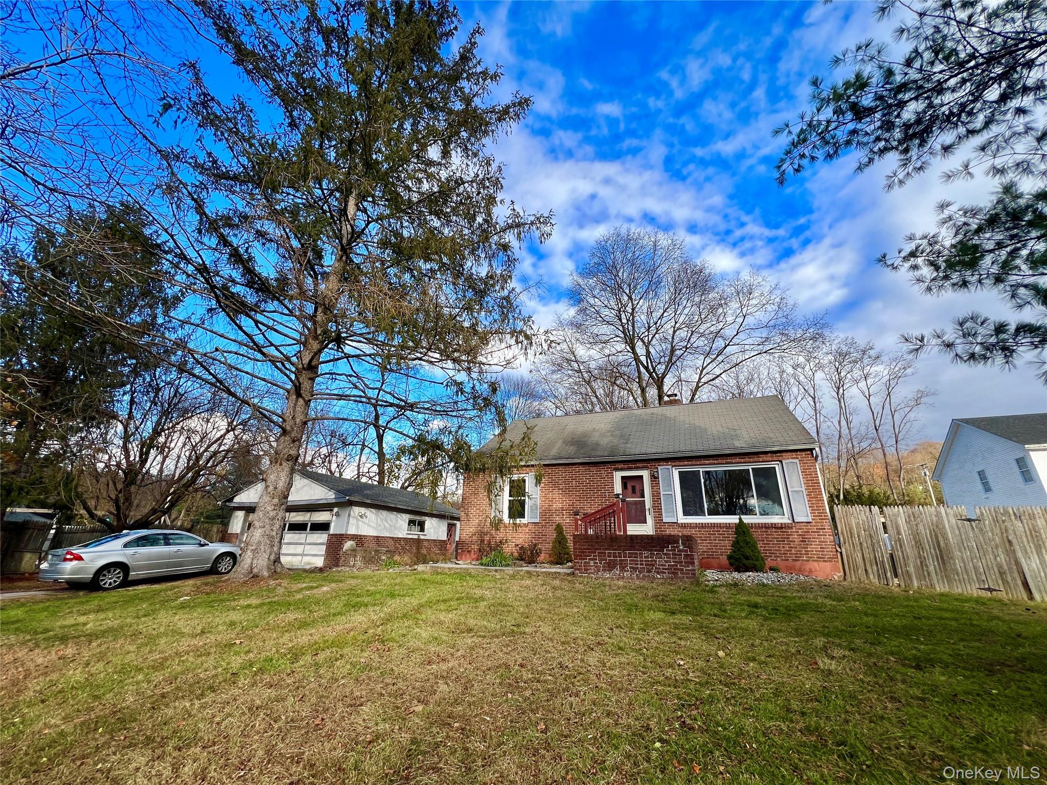 3 Davis Road Poughkeepsie, NY 12603 - Photo 4 of 34 View of front of house with brick siding, a garage, a chimney, and an outbuilding