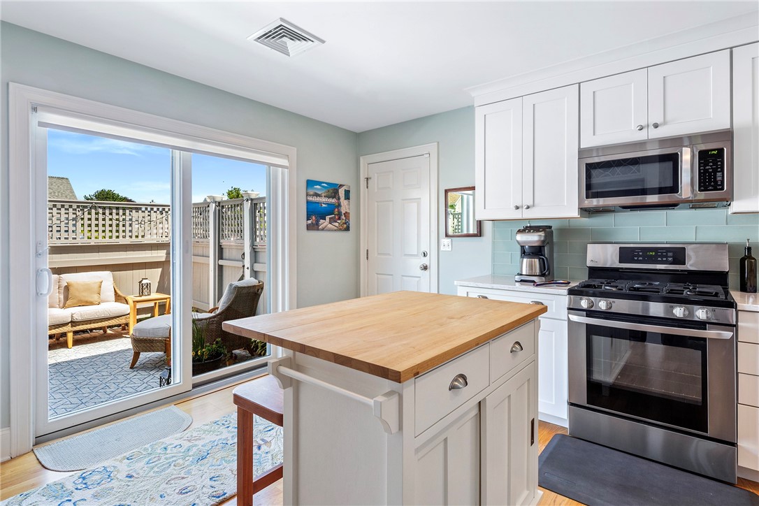 406 Corey Lane Middletown, RI 02842 - Photo 11 of 36 Fenced deck off kitchen for outdoor dining