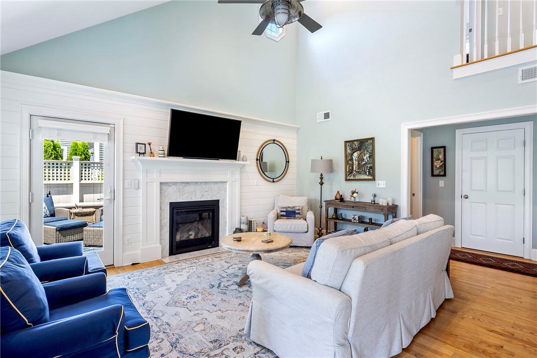 406 Corey Lane Middletown, RI 02842 - Photo 4 of 36 Spacious cathedral ceiling living room with ship lap wall and gas fireplace