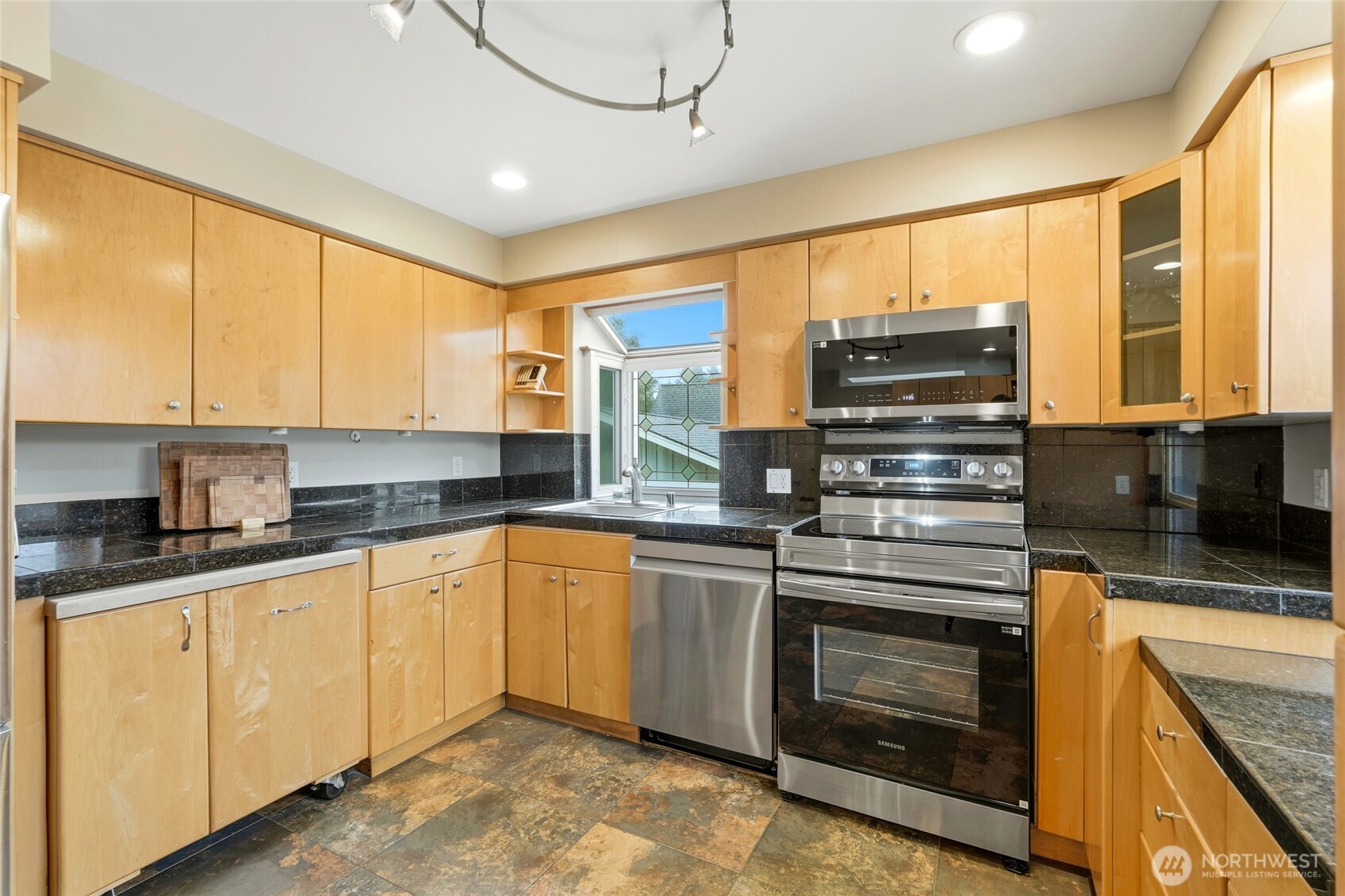 32130 27th Avenue Southwest Federal Way, WA 98023 - Photo 2 of 40 a kitchen with stainless steel appliances granite countertop a stove sink and cabinets
