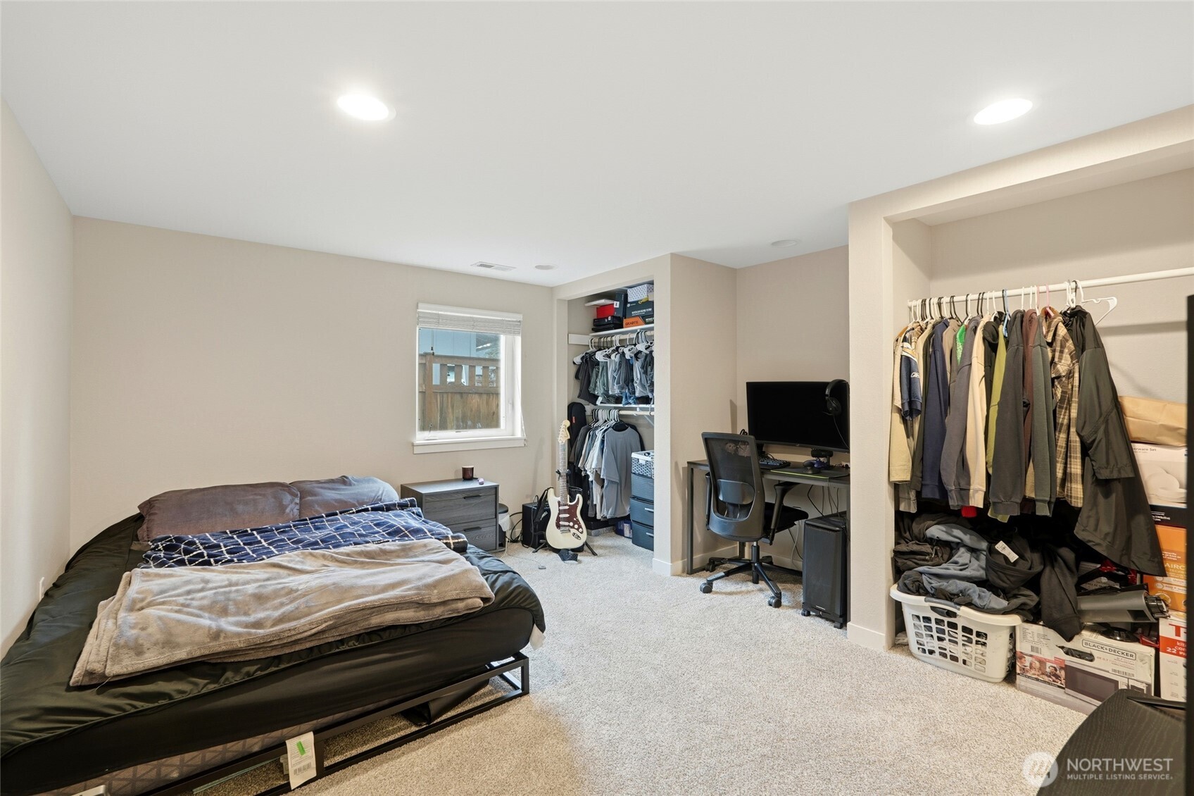 32130 27th Avenue Southwest Federal Way, WA 98023 - Photo 32 of 40 a bedroom with a bed and a flat tv screen