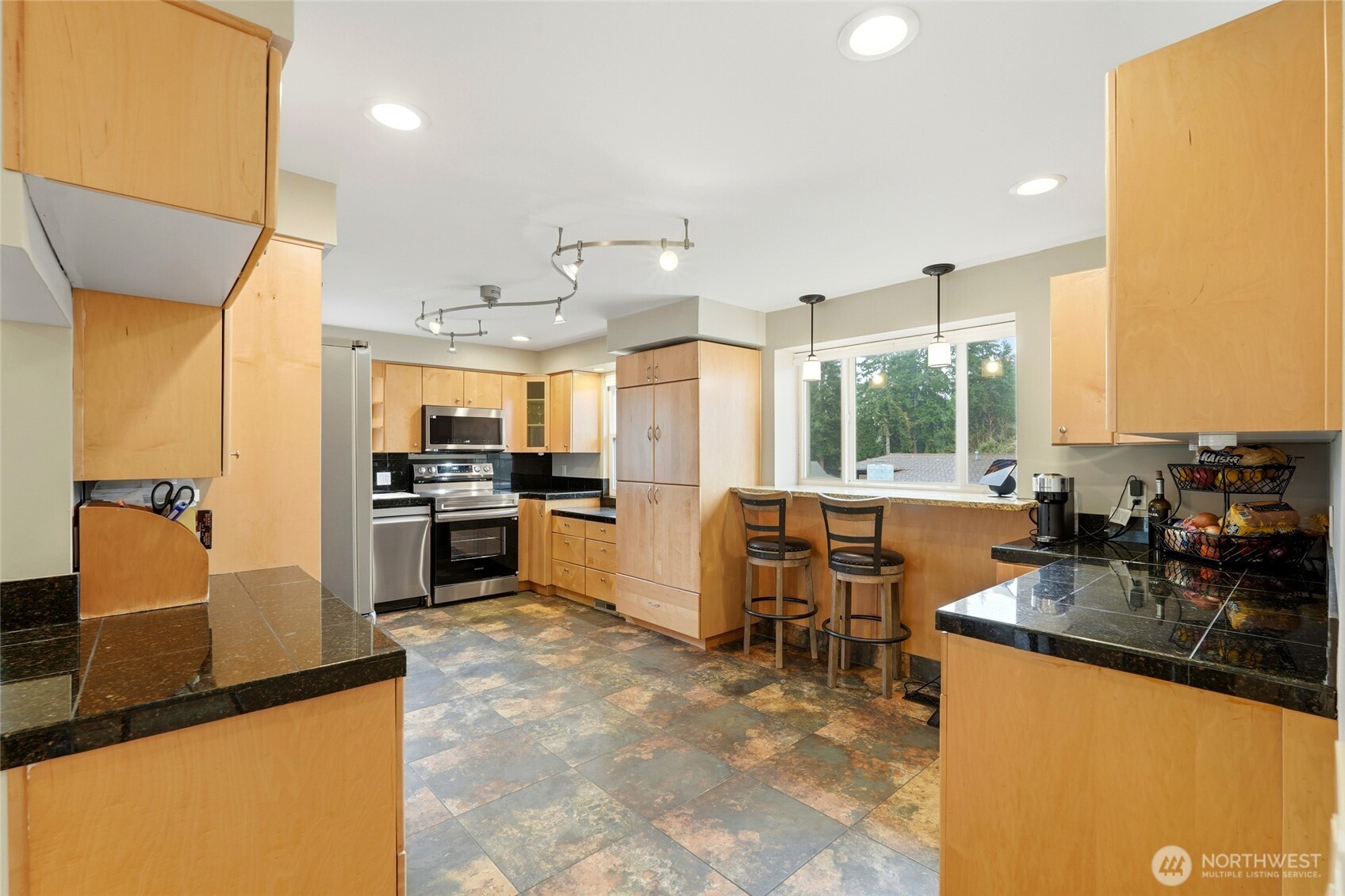 32130 27th Avenue Southwest Federal Way, WA 98023 - Photo 10 of 40 a kitchen with granite countertop a refrigerator stove top oven and sink