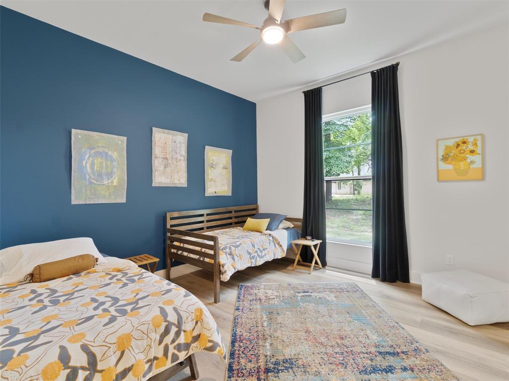 800 John Dean Road Gilmer, TX 75644 - Photo 38 of 40 a bedroom with two beds and a window