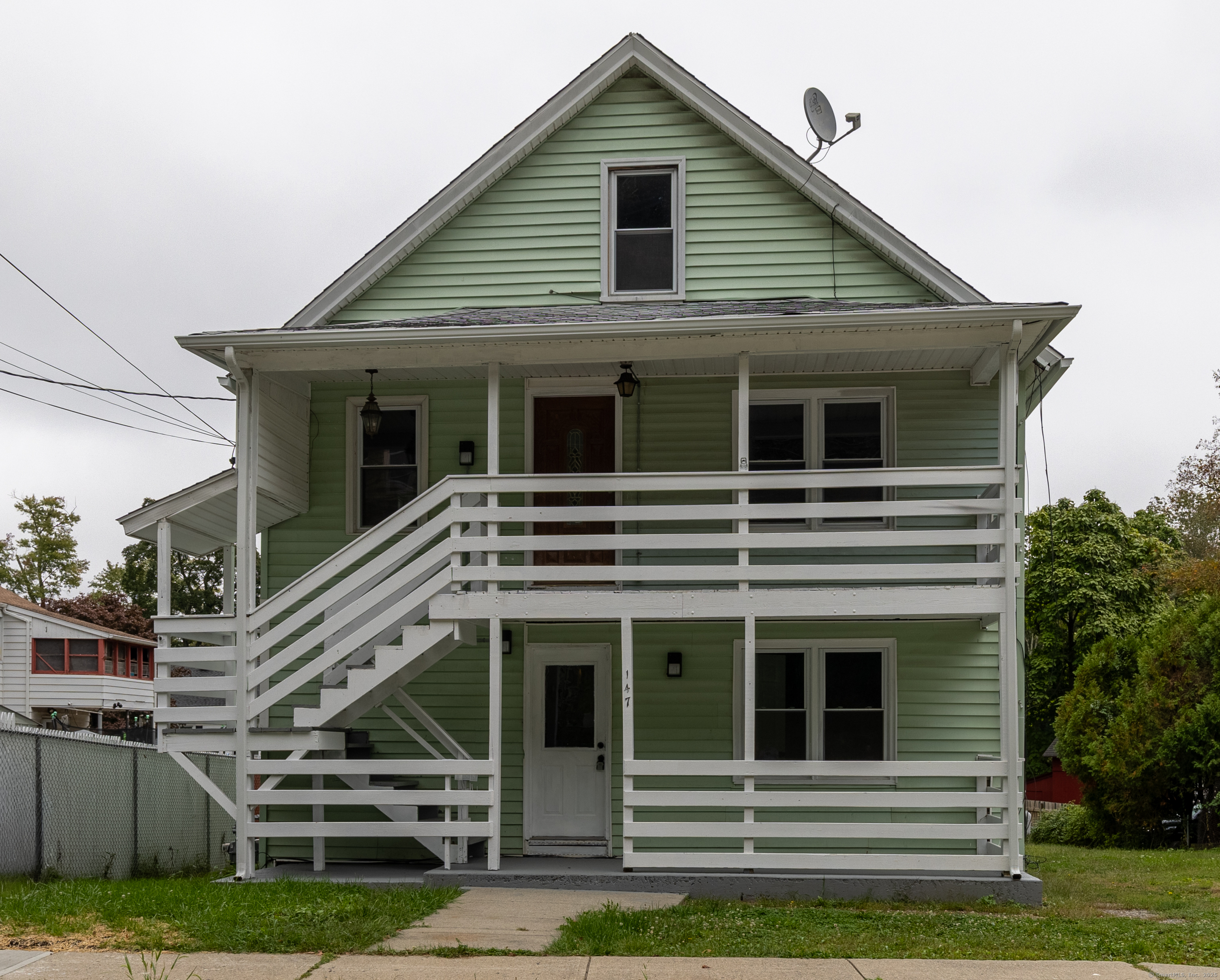 147 Asylum Street Norwich, CT 06360 - Photo 1 of 1 a front view of a house with a yard