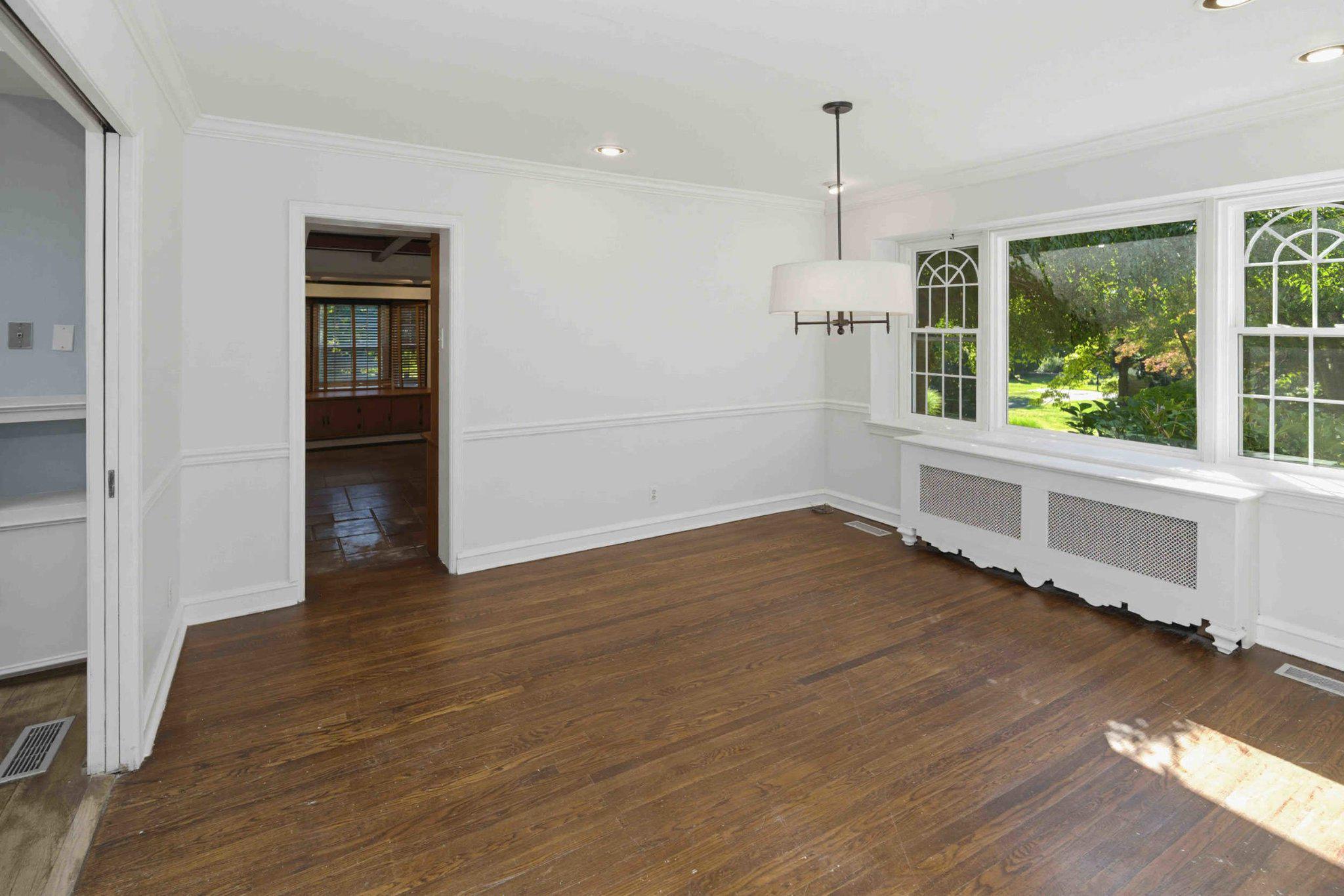1268 Rydal Road Jenkintown, PA 19046 - Photo 16 of 31 a view of an empty room with wooden floor and a window