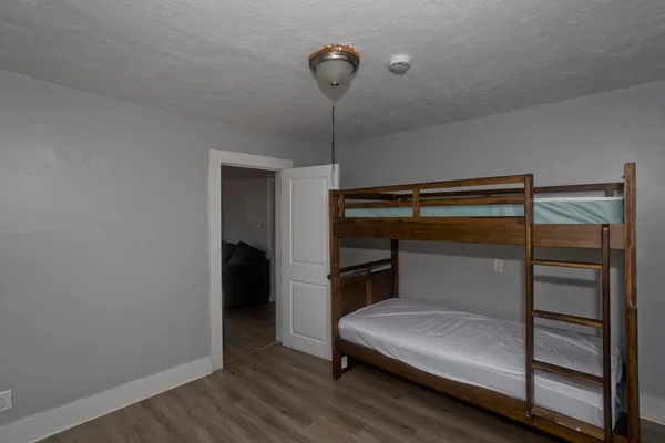a view of an empty room and wooden floor