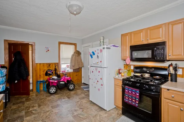 a kitchen with stainless steel appliances granite countertop a sink dishwasher and cabinets with wooden floor
