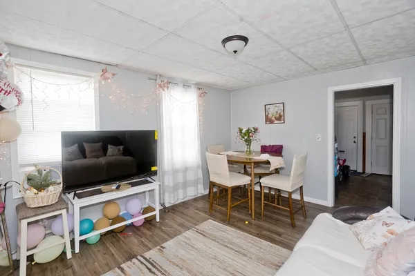 a bedroom with bed and a flat screen tv