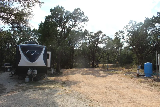 a fire hydrant sitting in the middle of a yard