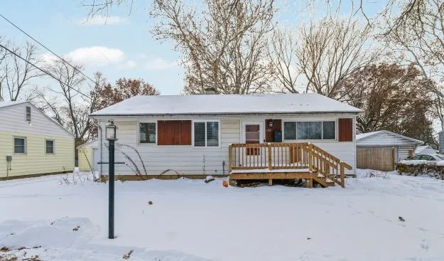 a view of house with a yard