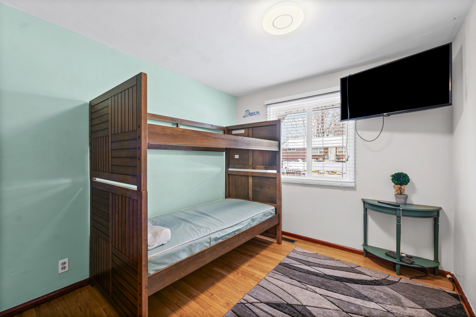 1511 Paula Drive Champaign, IL 61821 - Photo 12 of 24 a bedroom with a bed and a flat screen tv