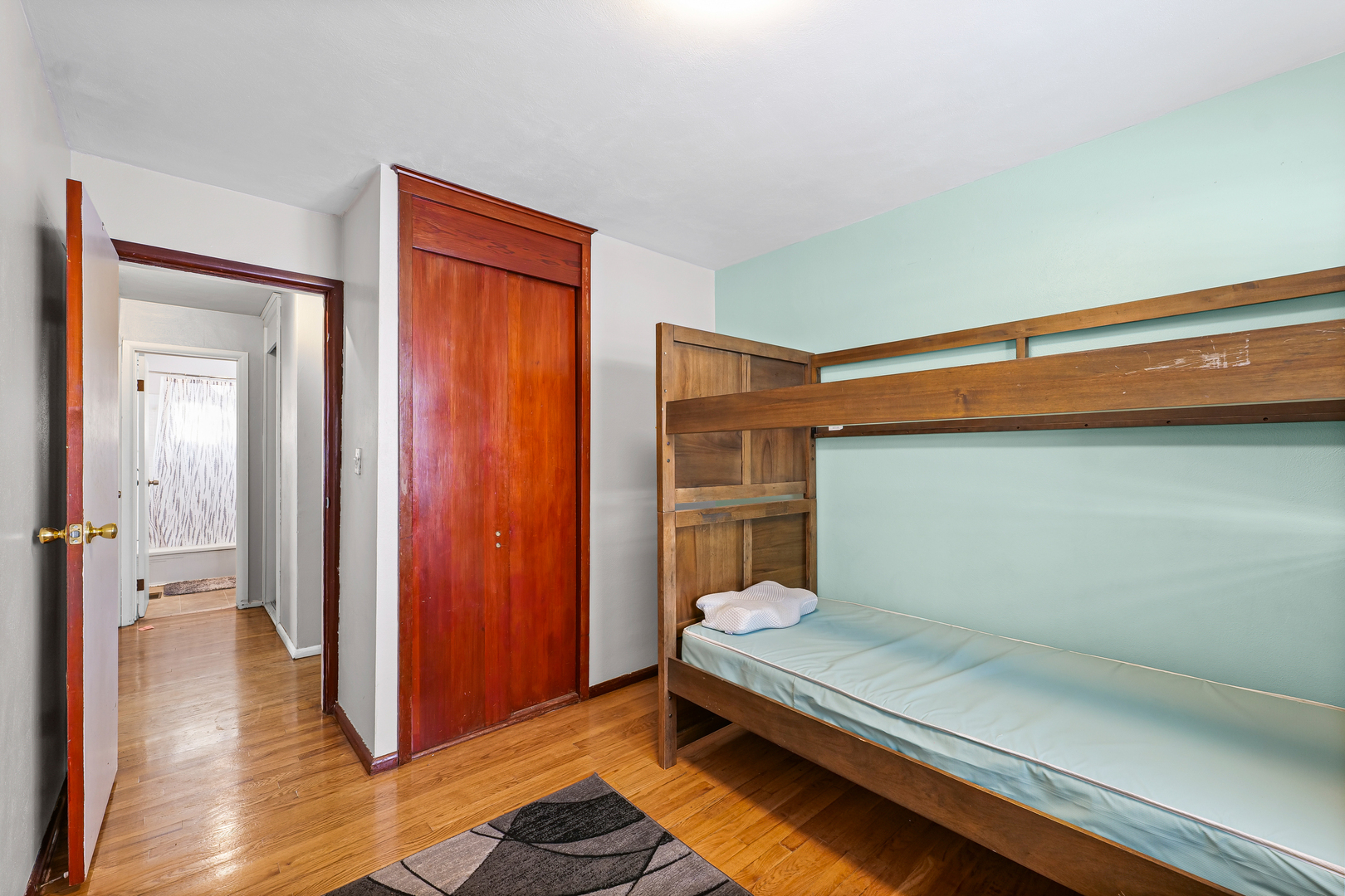 1511 Paula Drive Champaign, IL 61821 - Photo 13 of 24 a bedroom with a bed and wooden floor