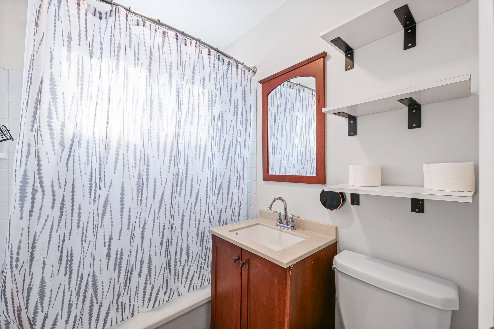 1511 Paula Drive Champaign, IL 61821 - Photo 14 of 24 a bathroom with a sink a toilet and a mirror