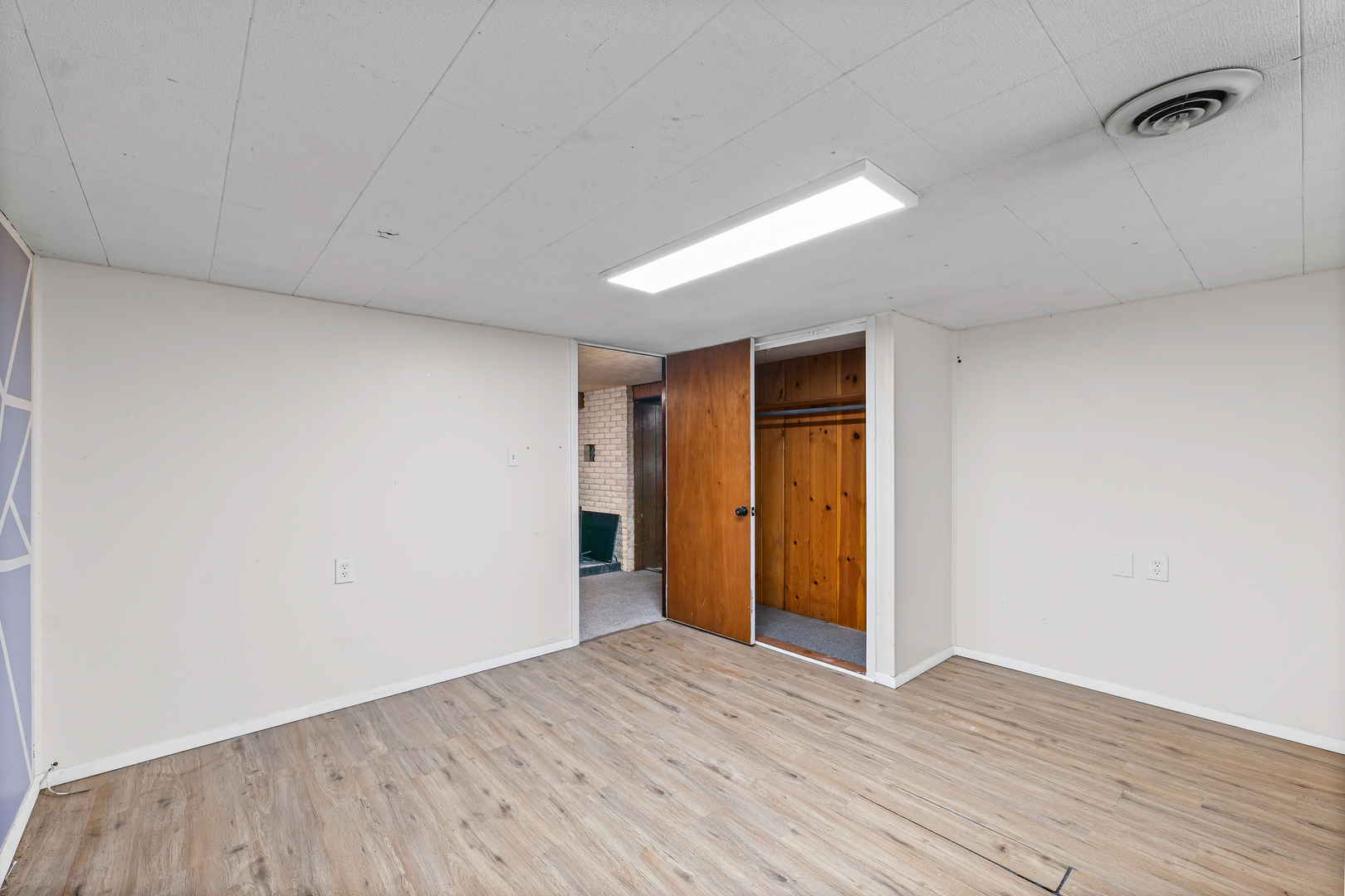 1511 Paula Drive Champaign, IL 61821 - Photo 19 of 24 a view of an empty room with wooden floor and closet