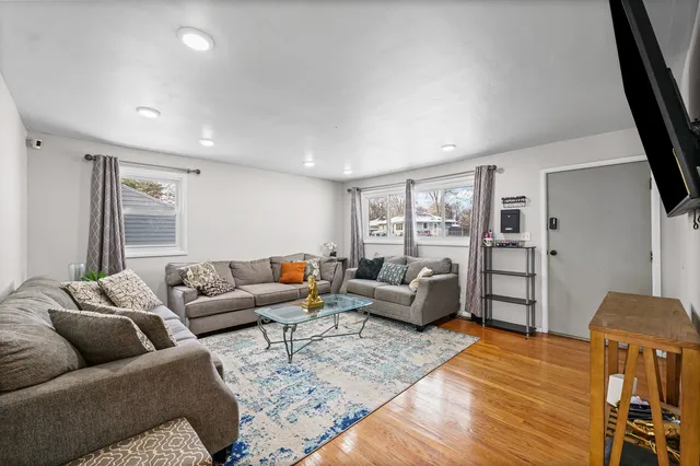 a living room with furniture and a large window