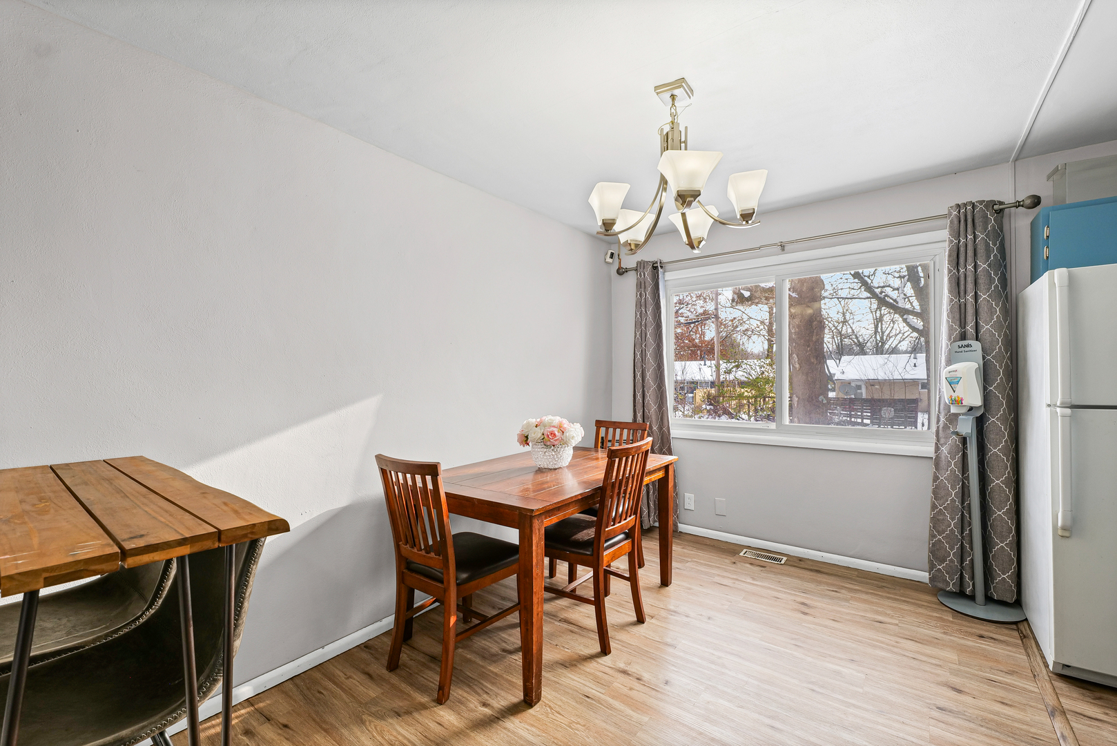 1511 Paula Drive Champaign, IL 61821 - Photo 6 of 24 a view of a dining room with furniture window and wooden floor