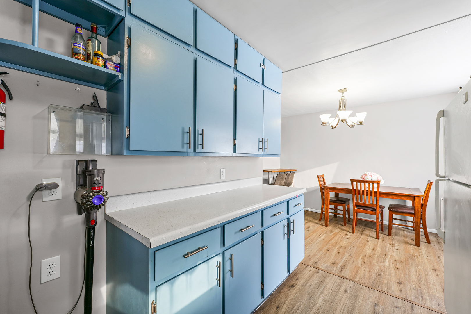 1511 Paula Drive Champaign, IL 61821 - Photo 8 of 24 a kitchen with a table chairs and white cabinets