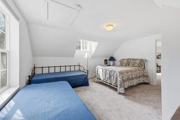 a room with a bed and a view of bedroom