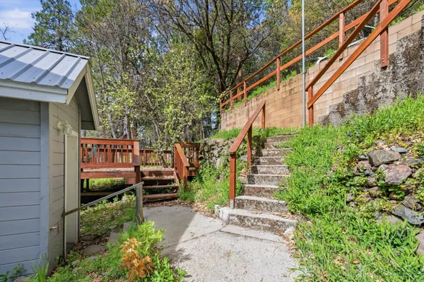 a view of balcony with wooden floor and outdoor seating