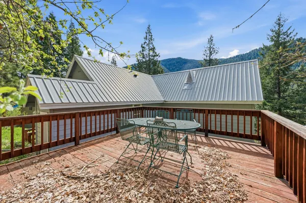 an aerial view of a residential houses with yard
