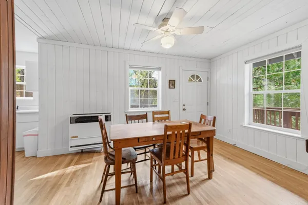 a view of a dining room with furniture window and outside view