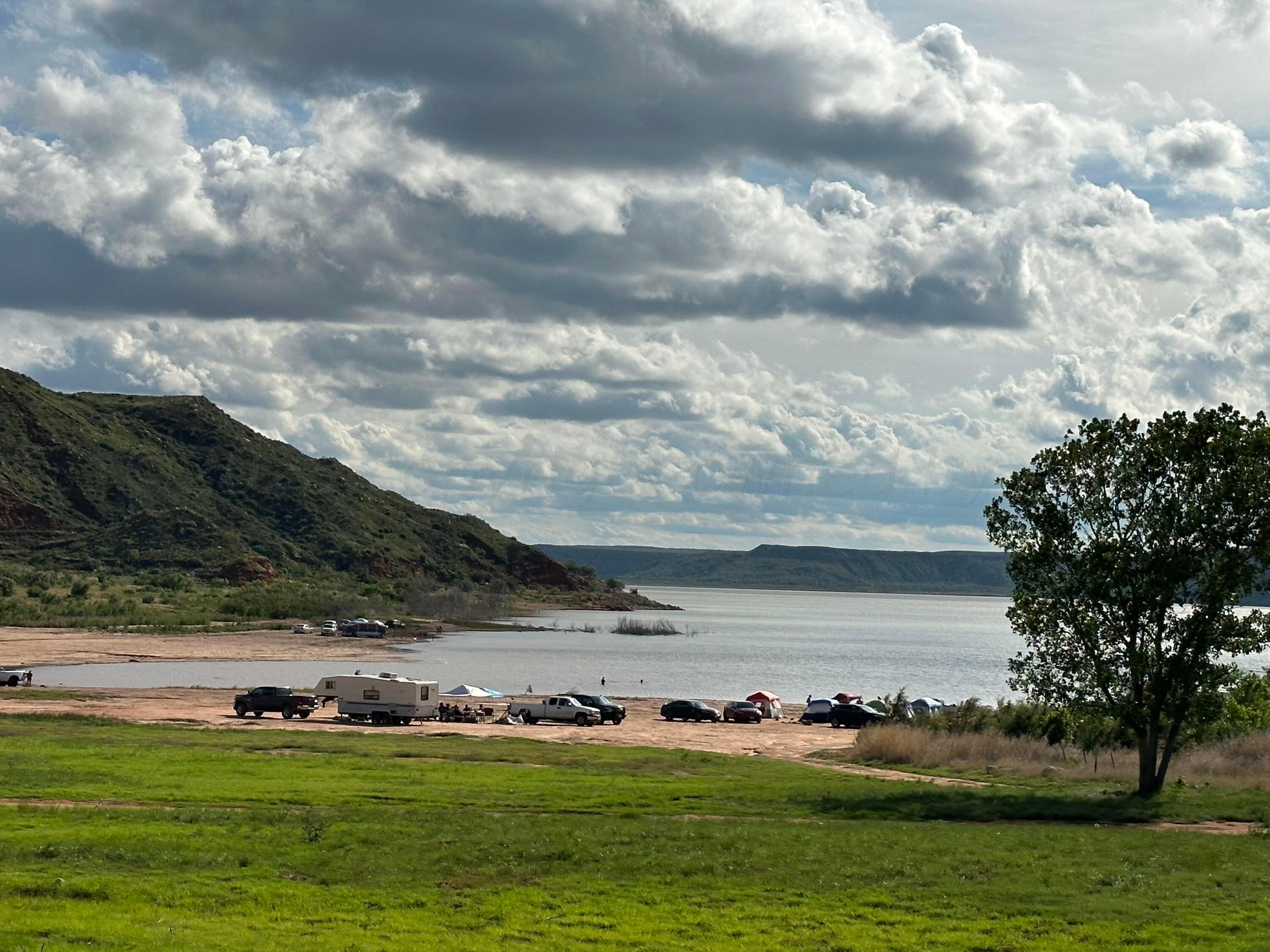 0 Lakeview Drive Fritch, TX 79036 - Photo 16 of 18 a view of building with yard and island in the background