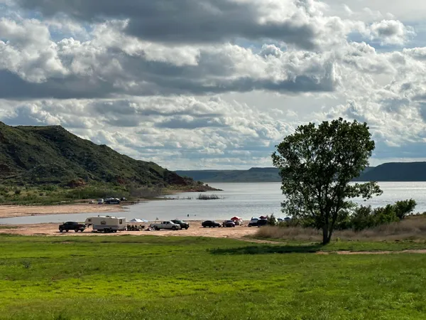 a view of a golf course with a lake