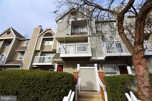 a front view of a house with large windows