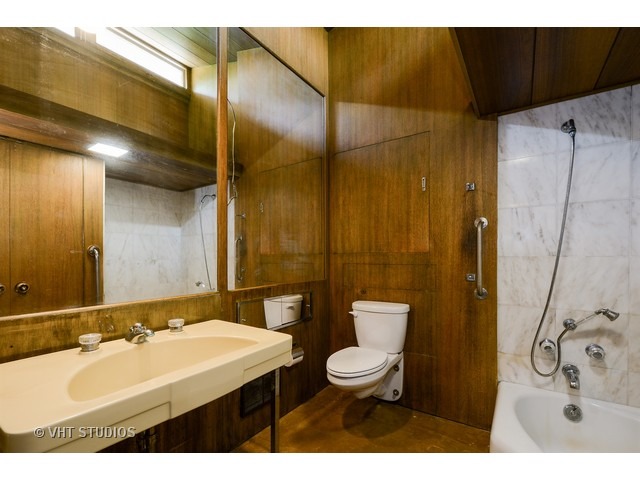 19 West County Line Road Barrington Hills, IL 60010 - Photo 12 of 22 a bathroom with a sink mirror toilet and shower