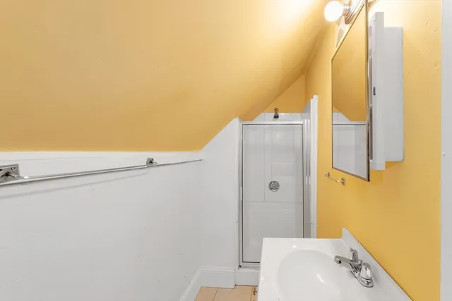 a bathroom with a bathtub and a sink