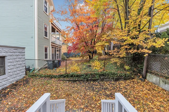 a view of a pathway both side of house