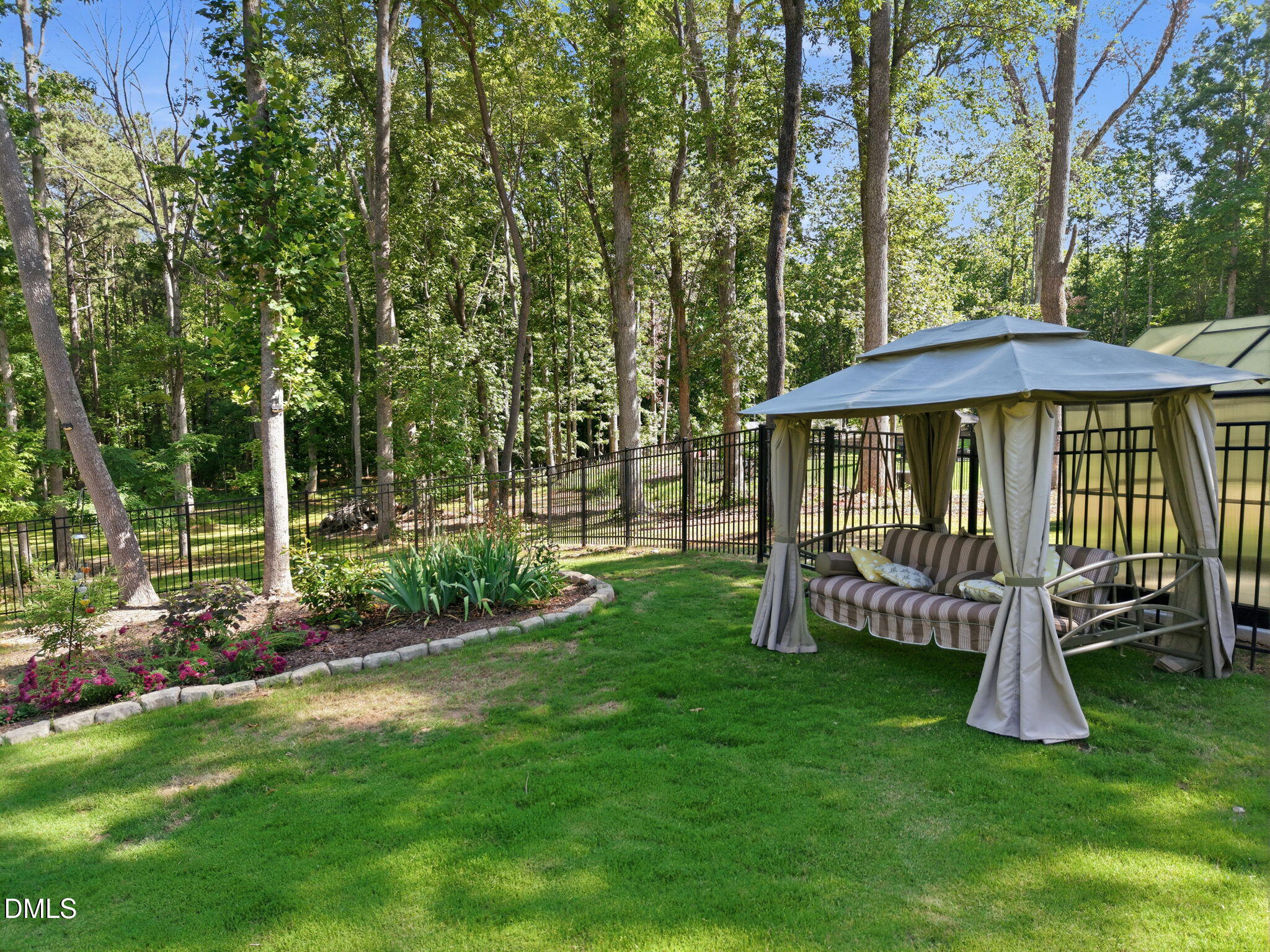 3511 Bruce Garner Road Wake Forest, NC 27587 - Photo 52 of 56 a view of a wooden deck and a yard with a slide